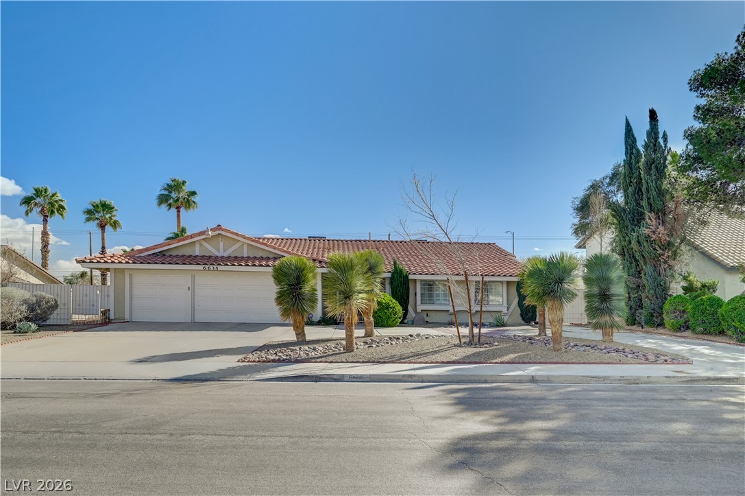 A well-maintained single-story home with a two-car garage and desert-friendly landscaping welcomes you.