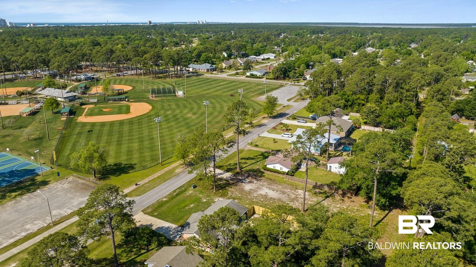 348 West 22nd Avenue Gulf Shores, AL 36542 - Photo 7 of 13 Birds eye view of property featuring a view of trees