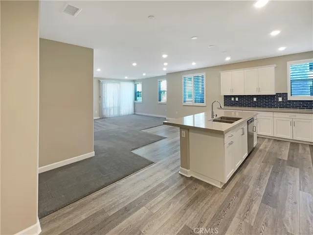 an empty room with closet and mirror