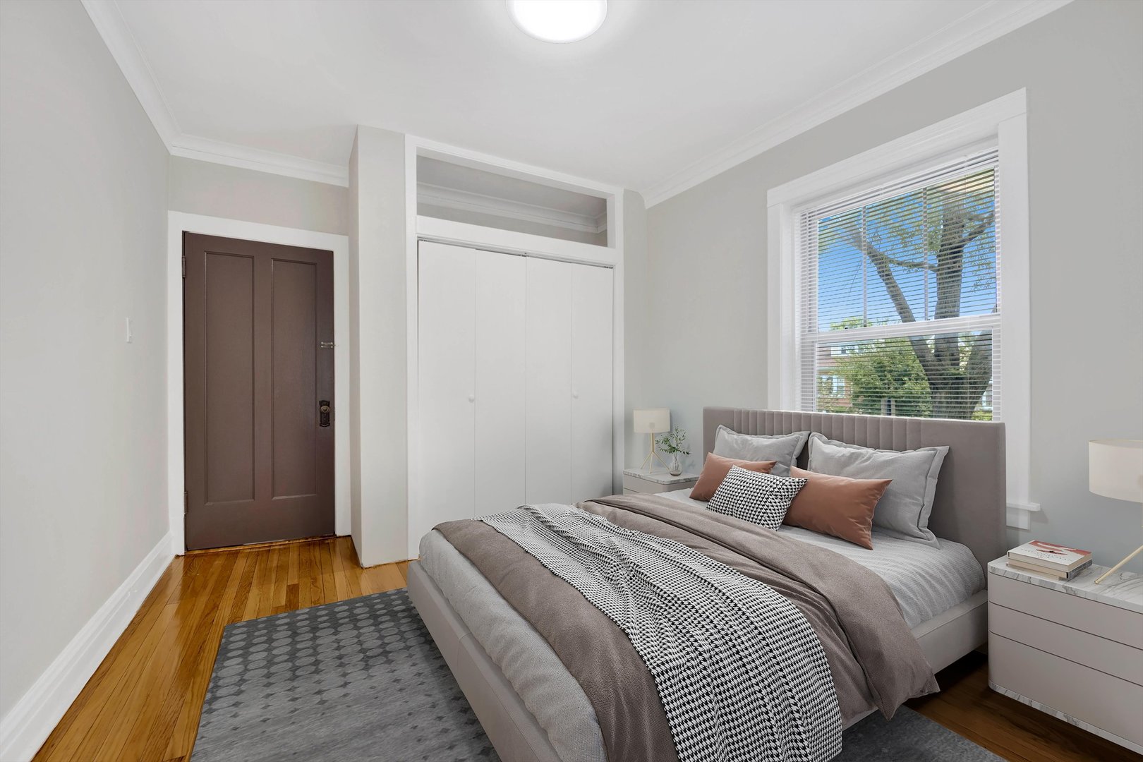 4744 West Roscoe Street, Unit 2 Chicago, IL 60641 - Photo 5 of 14 a bedroom with a bed and a window