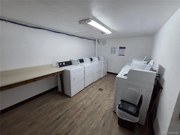 a room with furniture and wooden floor