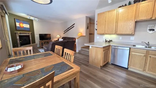 a kitchen with a sink appliances and cabinets