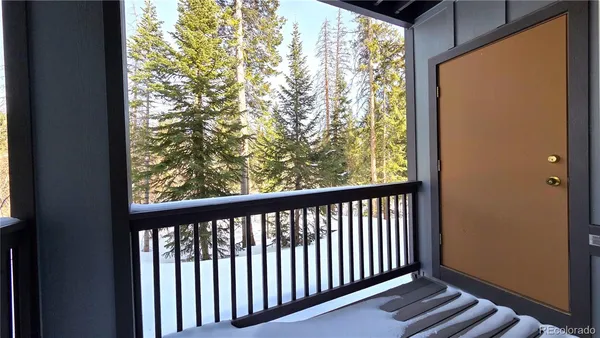 a view of a balcony with wooden floor