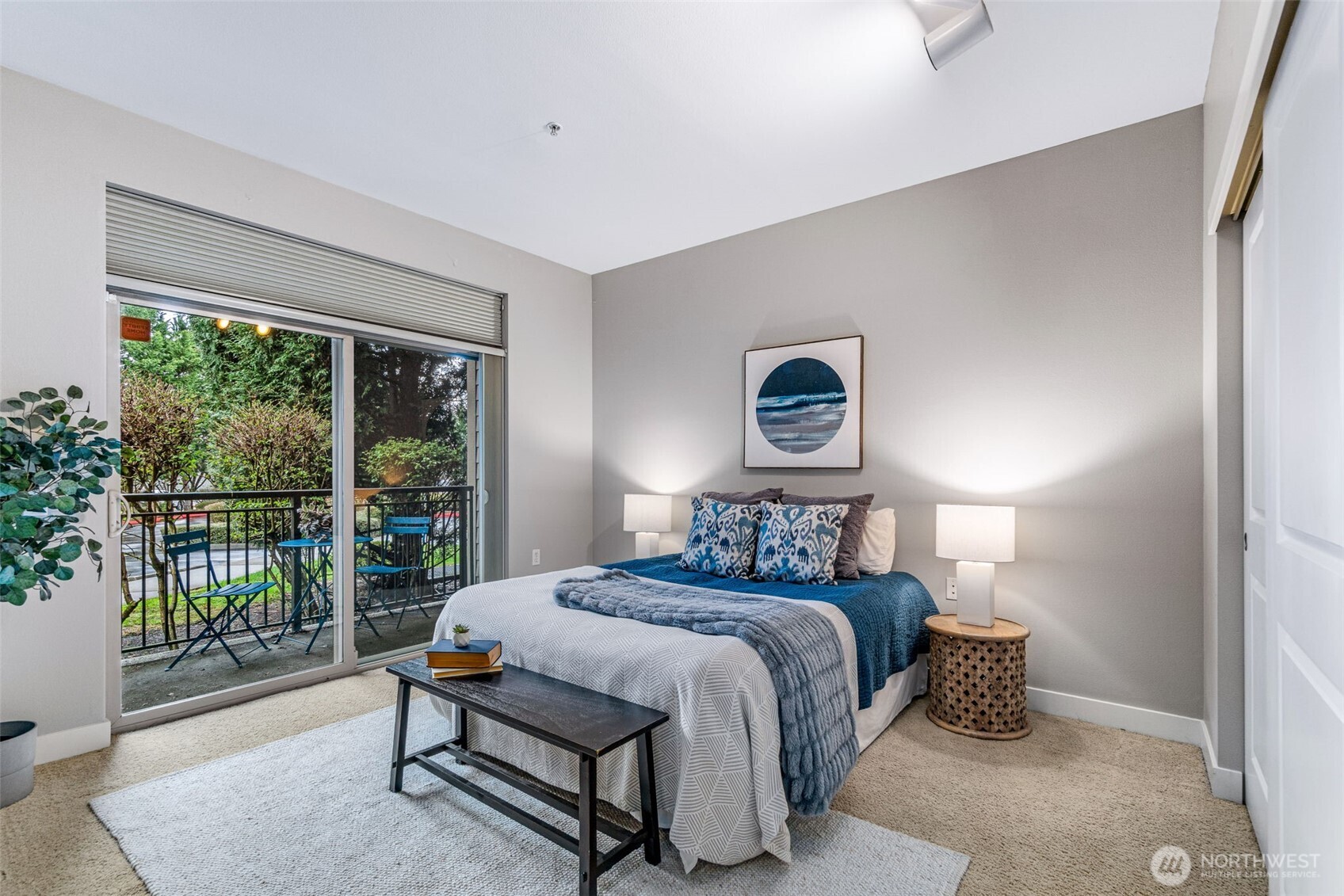 15700 116th Avenue Northeast, Unit 102A Bothell, WA 98011 - Photo 15 of 35 a bedroom with a bed and a large window