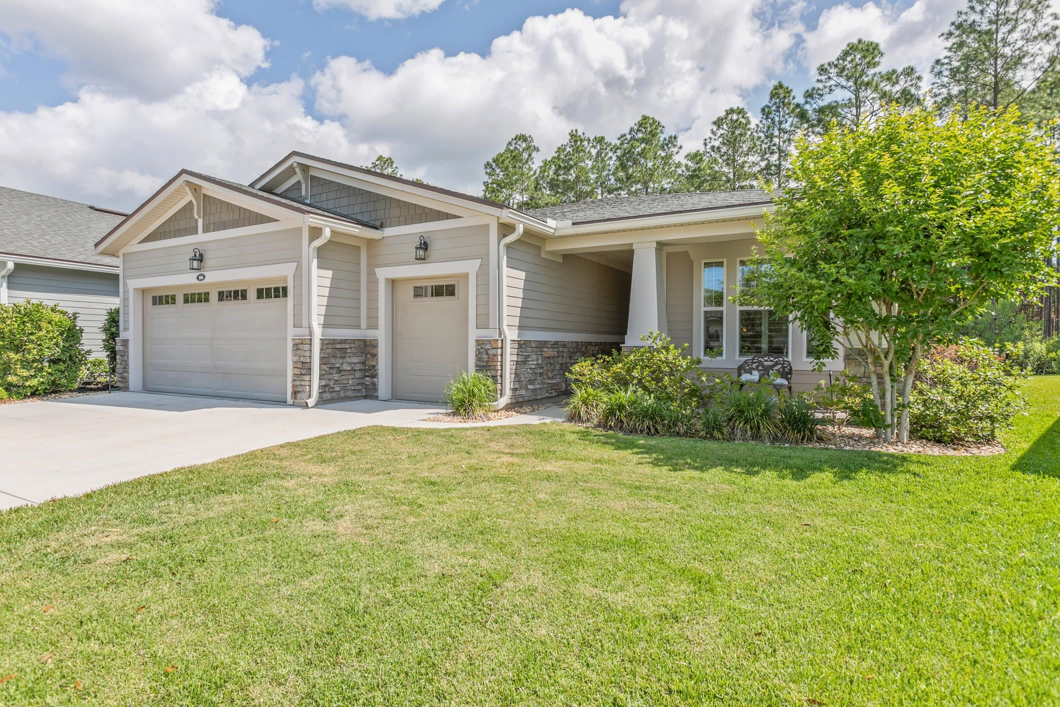 front view of a house with a yard
