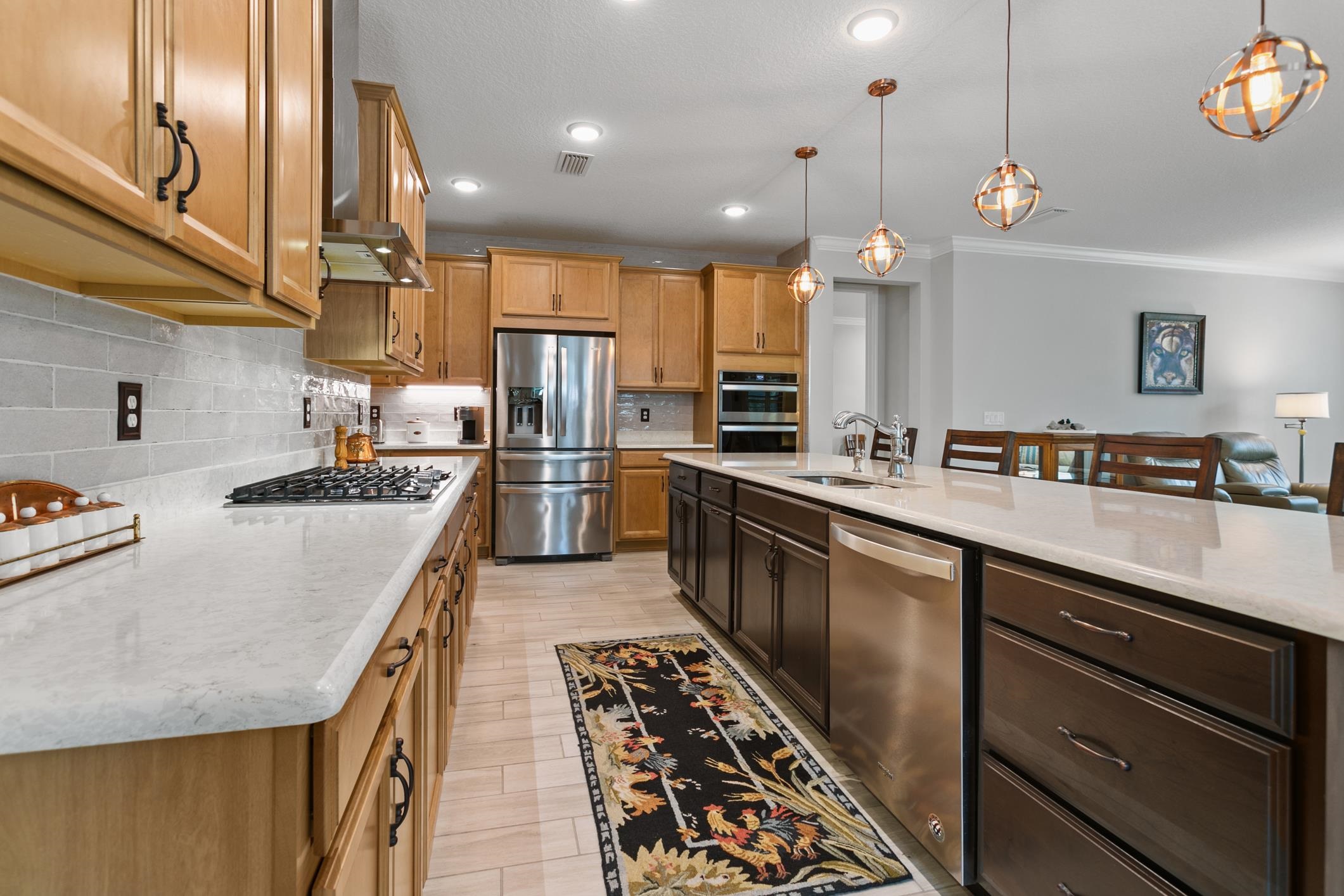 106 Key Grass Court St. Johns, FL 32259 - Photo 29 of 98 a kitchen with stainless steel appliances granite countertop a sink a stove and a refrigerator