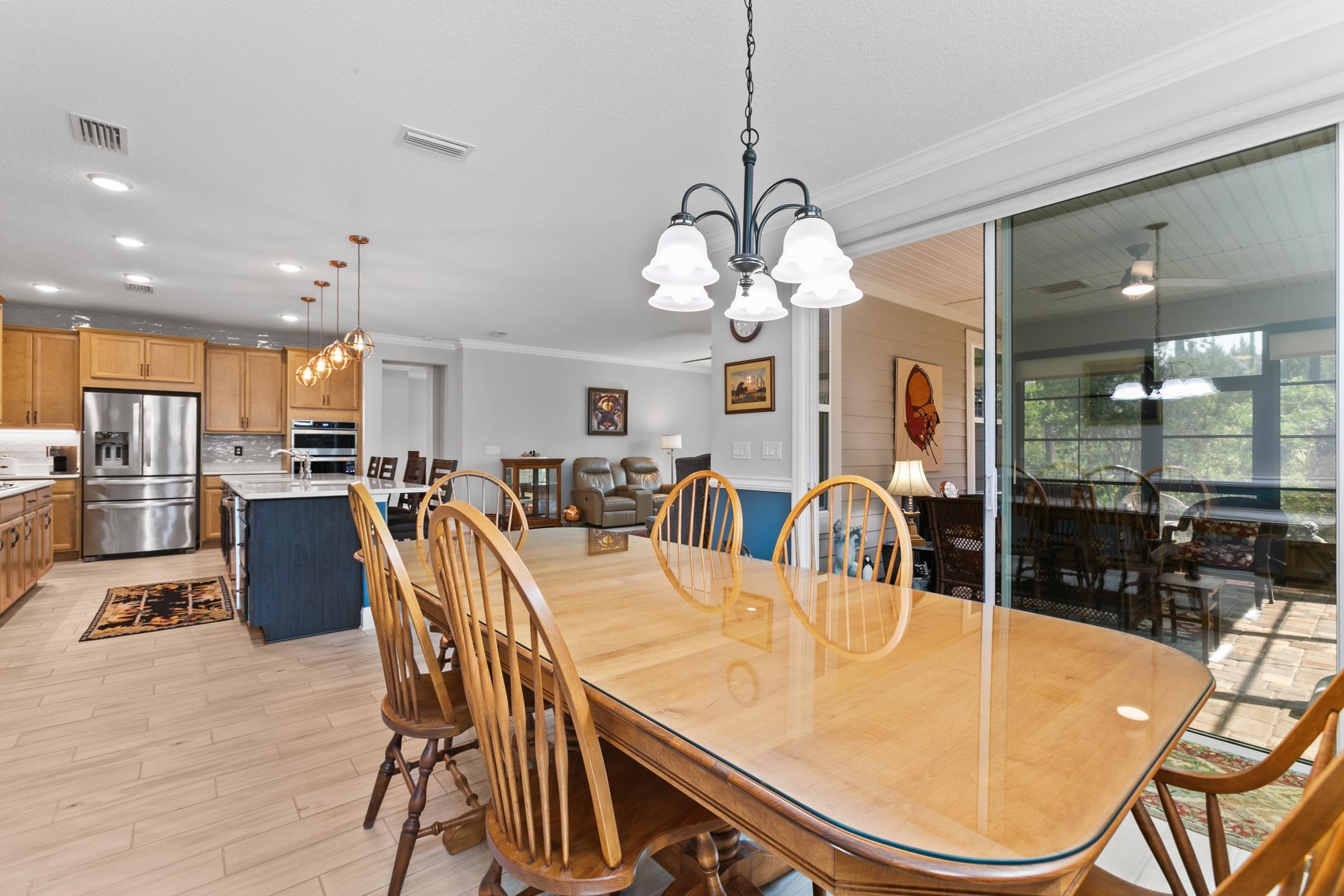 106 Key Grass Court St. Johns, FL 32259 - Photo 40 of 98 a dining room filled chandelier and kitchen view