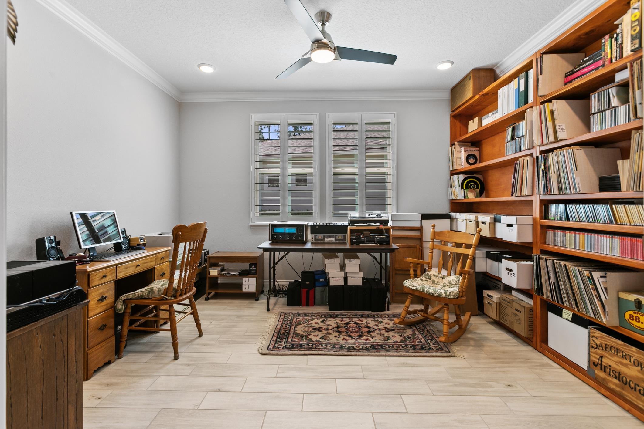 106 Key Grass Court St. Johns, FL 32259 - Photo 42 of 98 a view of a workspace with furniture and a bookshelf