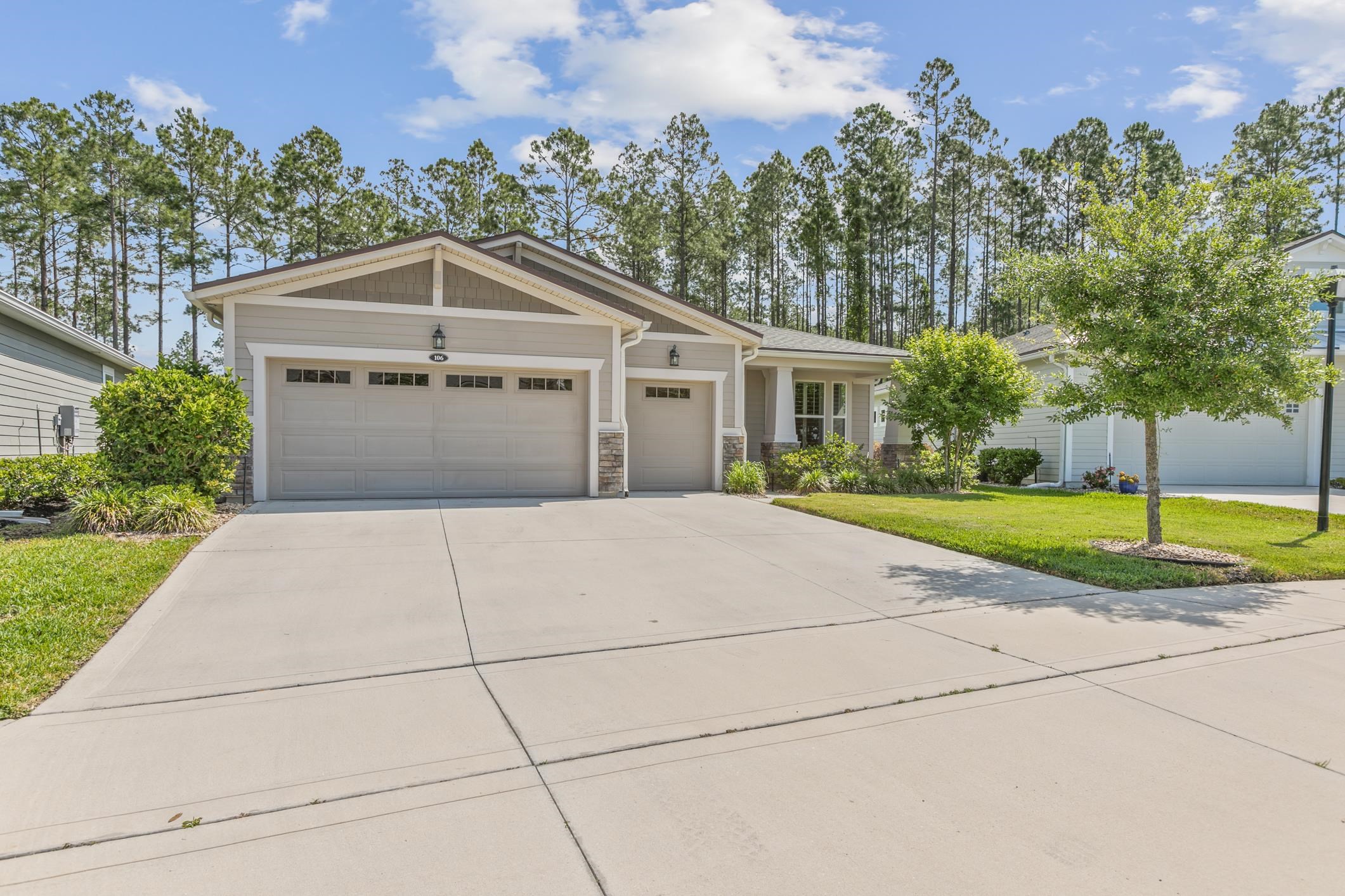 106 Key Grass Court St. Johns, FL 32259 - Photo 48 of 98 a front view of a house with a yard and trees