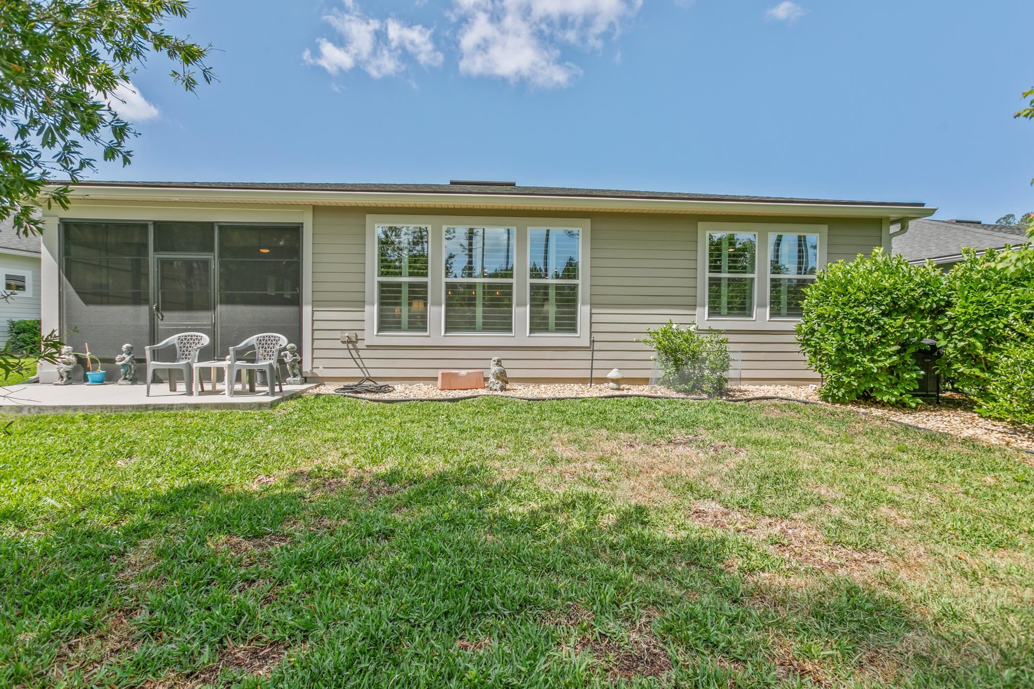 106 Key Grass Court St. Johns, FL 32259 - Photo 51 of 98 a front view of house with yard and outdoor seating
