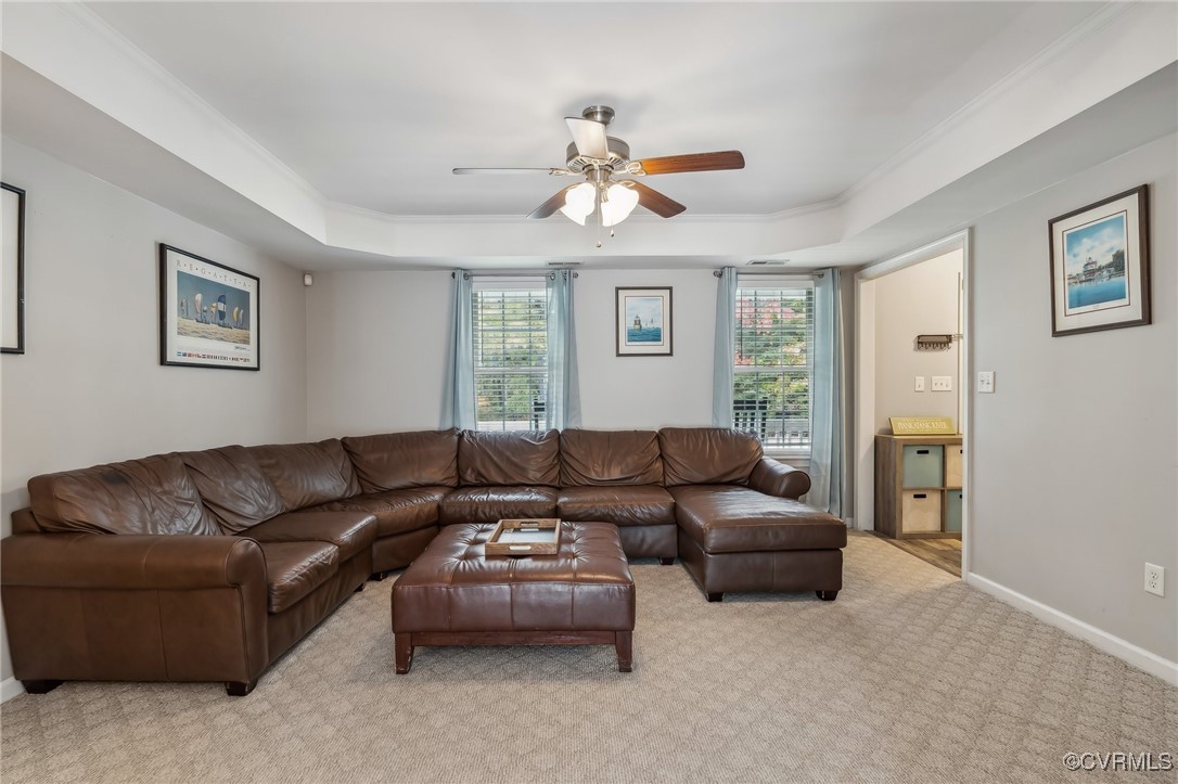 1121 Coachpoint Road Hartfield, VA 23071 - Photo 11 of 46 Carpeted living room featuring plenty of natural l
