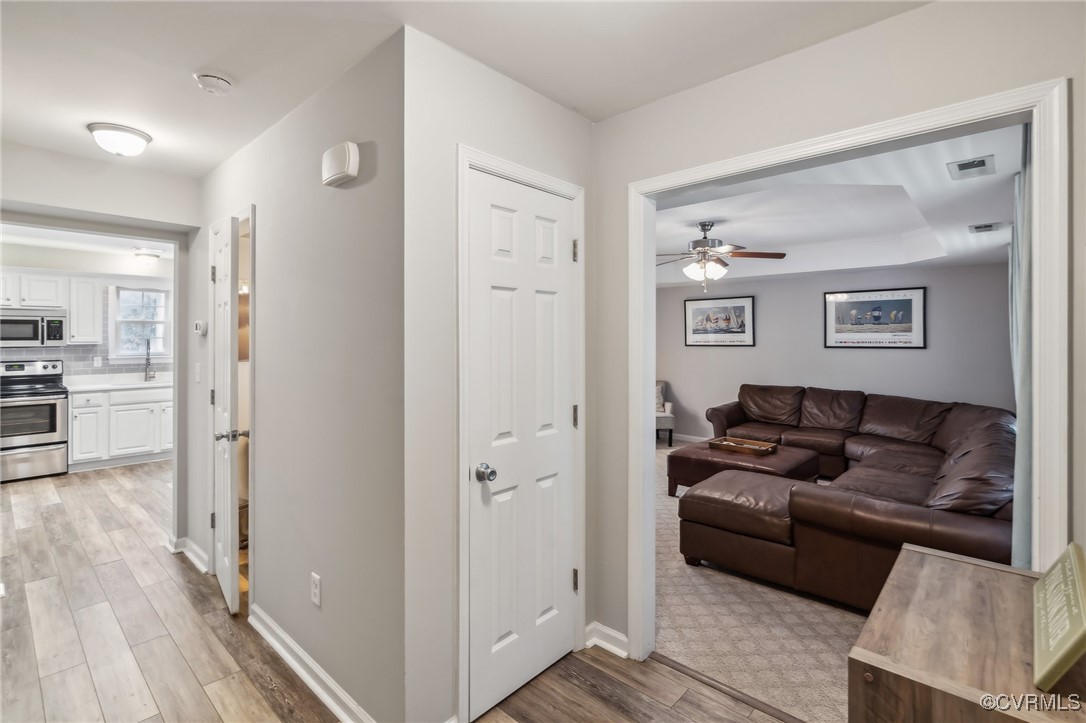 1121 Coachpoint Road Hartfield, VA 23071 - Photo 13 of 46 Hall with light hardwood / wood-style flooring