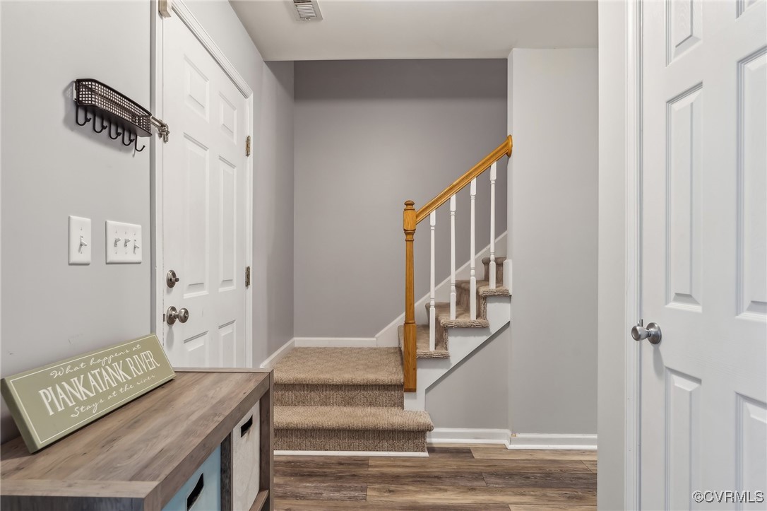 1121 Coachpoint Road Hartfield, VA 23071 - Photo 14 of 46 Foyer entrance with wood-type flooring