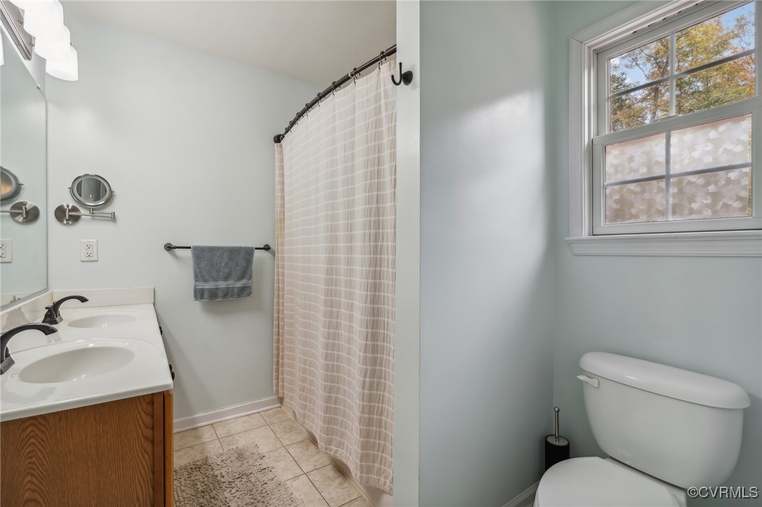 1121 Coachpoint Road Hartfield, VA 23071 - Photo 21 of 46 Bathroom featuring a shower with curtain, tile pat