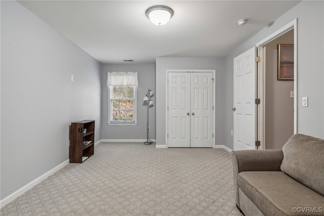 1121 Coachpoint Road Hartfield, VA 23071 - Photo 24 of 46 Sitting room with light carpet