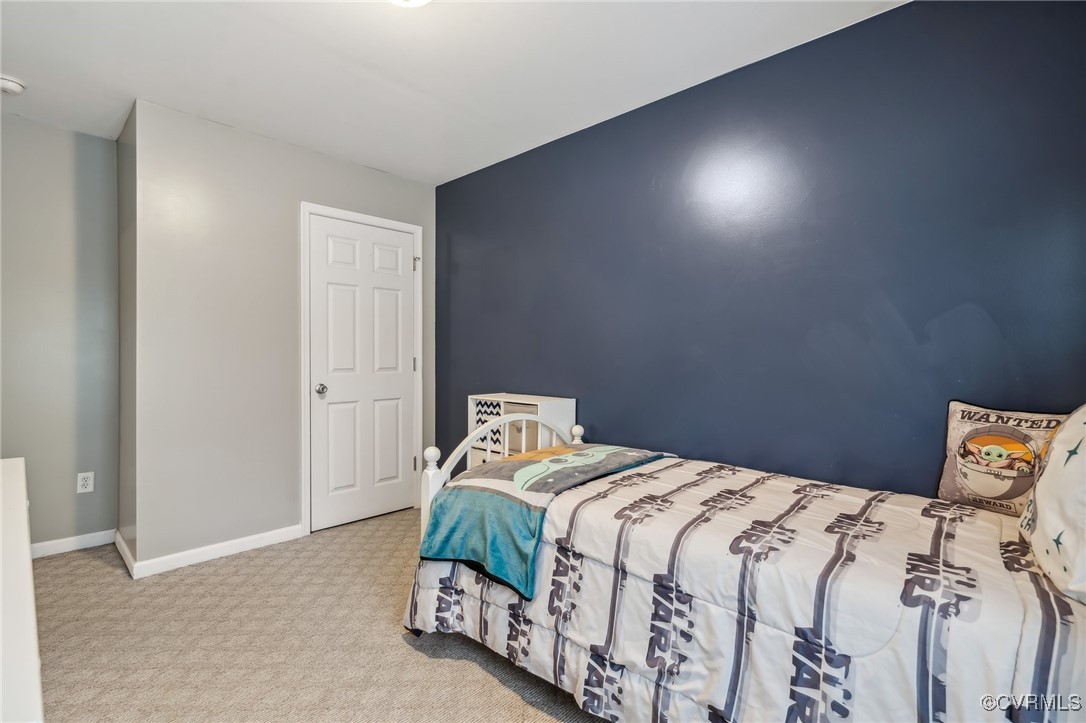 1121 Coachpoint Road Hartfield, VA 23071 - Photo 27 of 46 Bedroom with light colored carpet