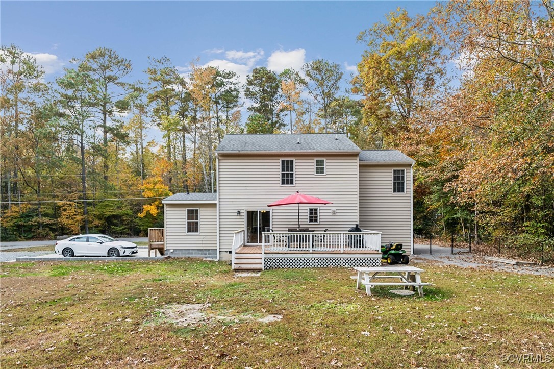 1121 Coachpoint Road Hartfield, VA 23071 - Photo 33 of 46 Back of property featuring a yard and a wooden dec