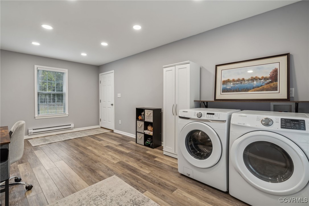 1121 Coachpoint Road Hartfield, VA 23071 - Photo 5 of 46 Clothes washing area with cabinets, a baseboard ra