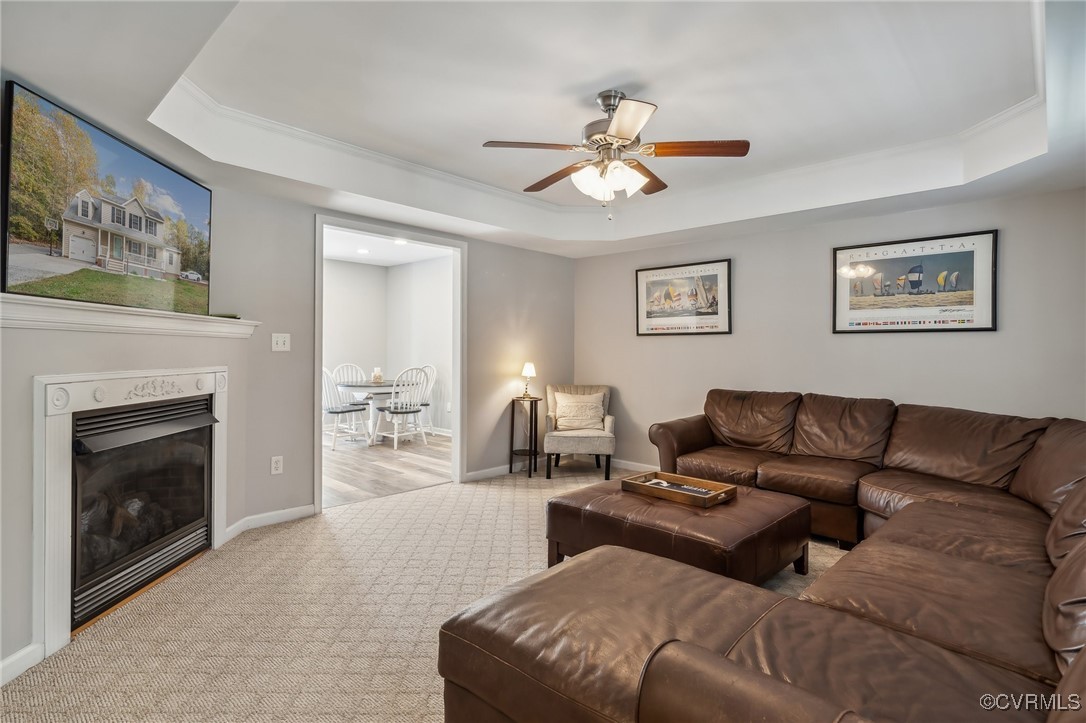 1121 Coachpoint Road Hartfield, VA 23071 - Photo 10 of 46 Living room featuring ornamental molding, light ca