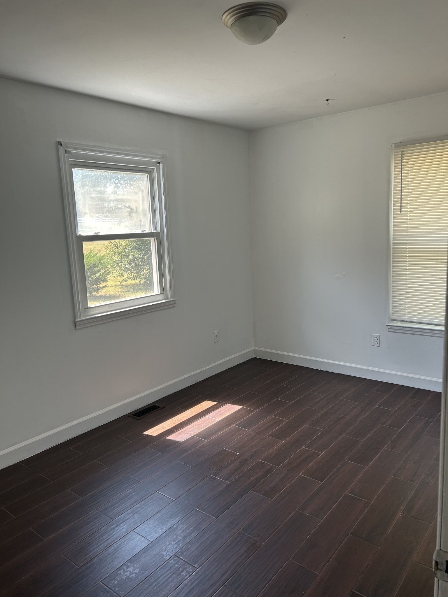 4264 Port Royal Road Spring Hill, TN 37174 - Photo 7 of 14 a view of an empty room with wooden floor and a window