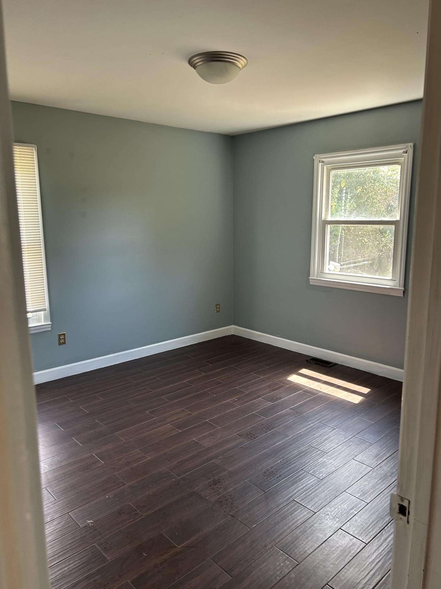 4264 Port Royal Road Spring Hill, TN 37174 - Photo 8 of 14 an empty room with wooden floor and windows