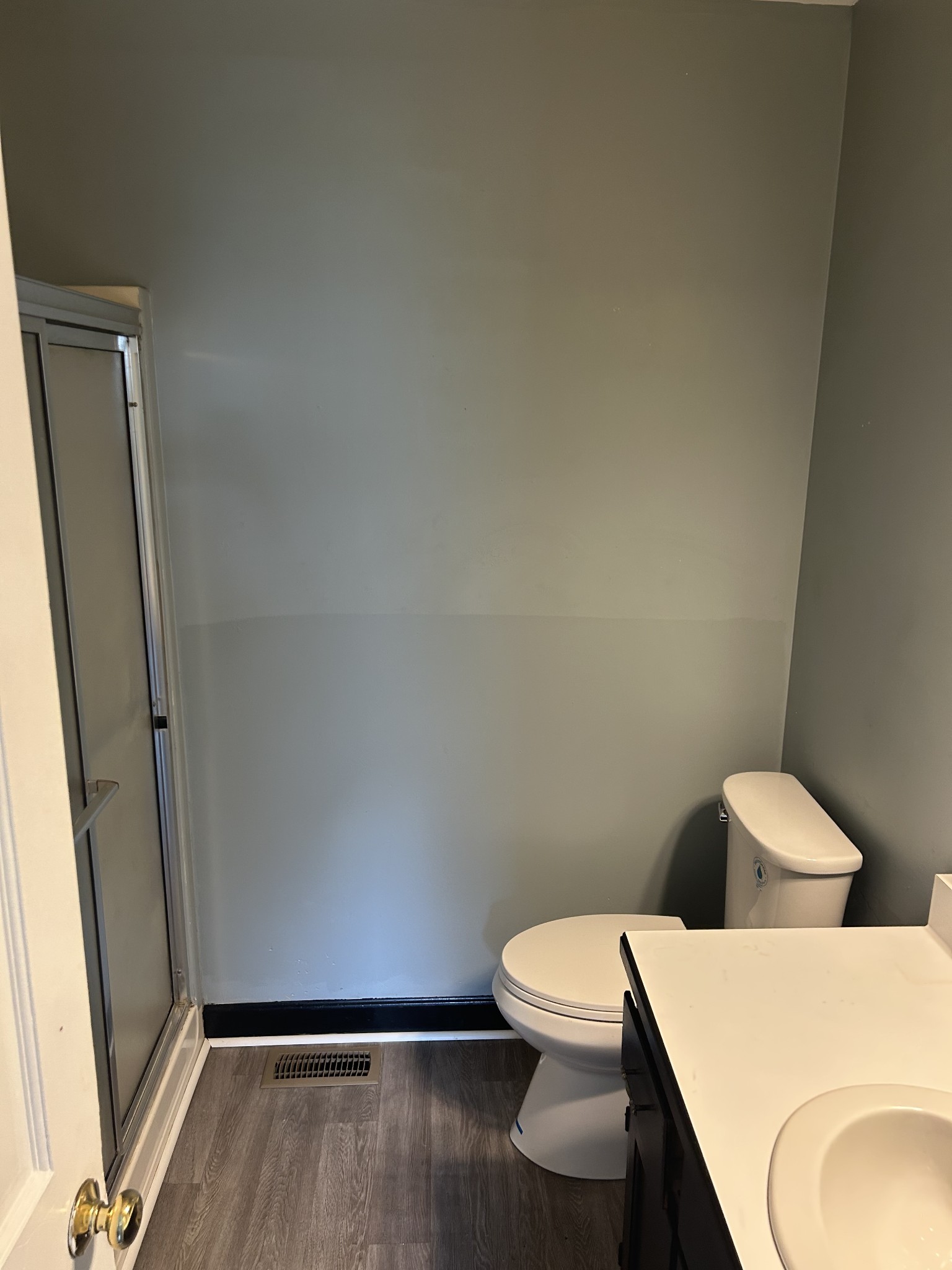 4264 Port Royal Road Spring Hill, TN 37174 - Photo 10 of 14 a white toilet sitting next to a bathroom sink