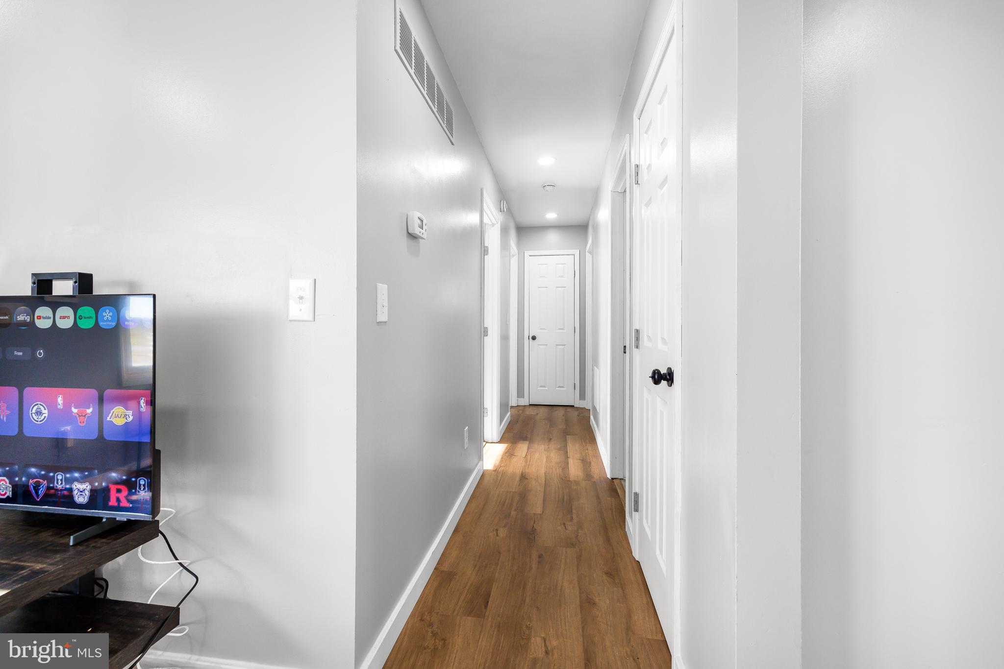 22041 Neal Road Lincoln, DE 19960 - Photo 14 of 28 a view of a hallway with wooden floor and closet