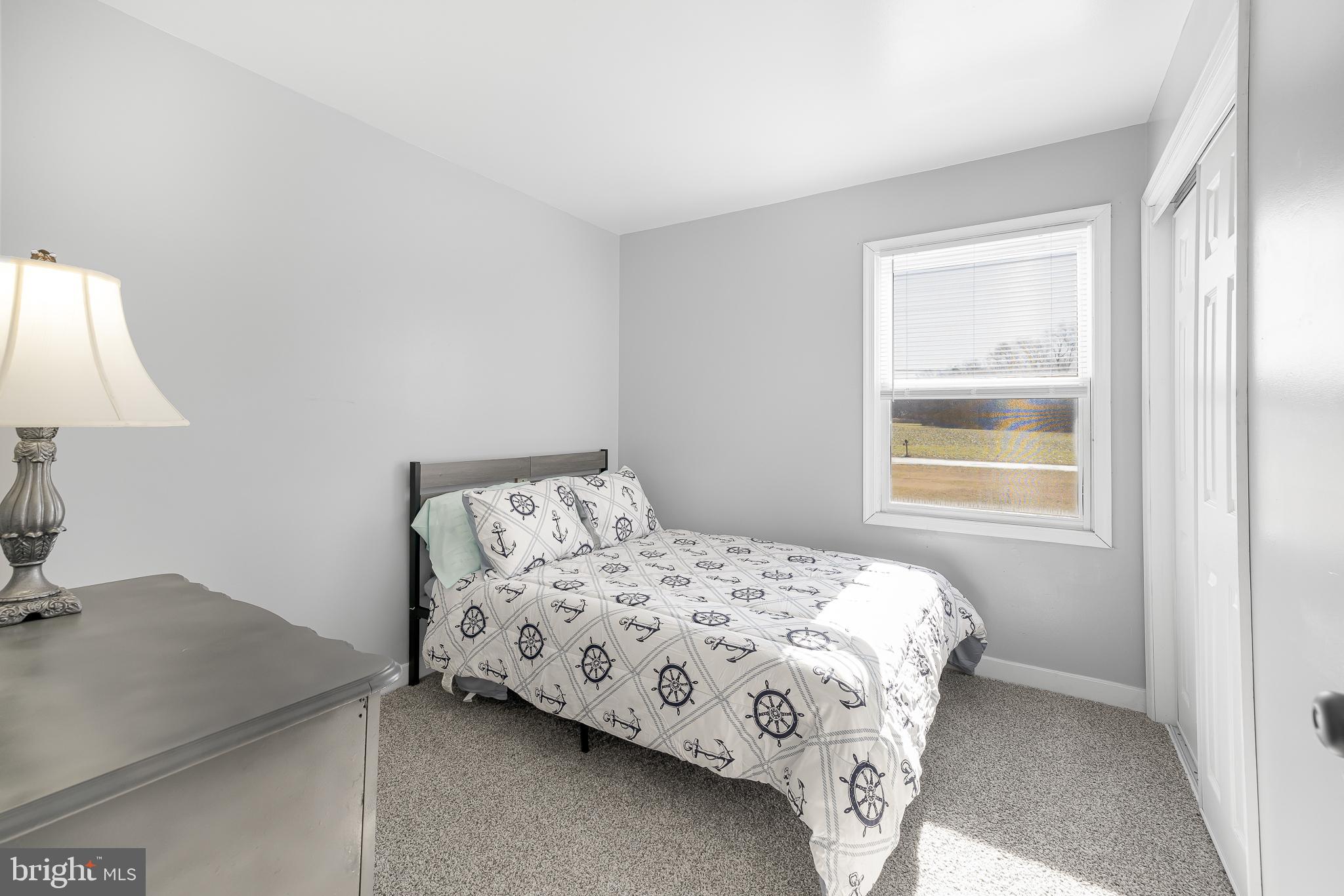 22041 Neal Road Lincoln, DE 19960 - Photo 15 of 28 a bedroom with a bed and a window