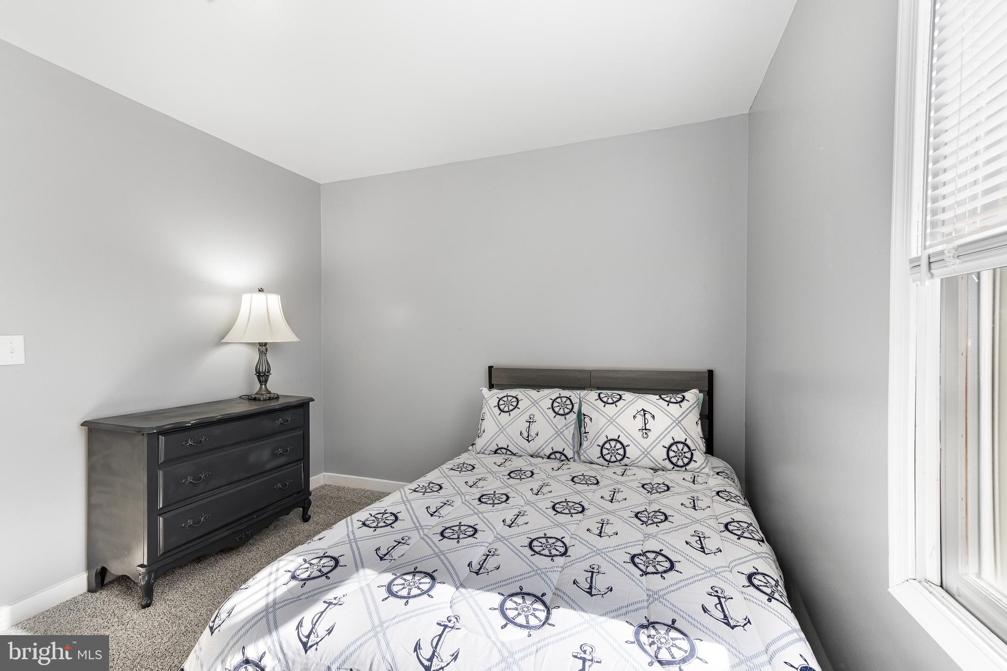 22041 Neal Road Lincoln, DE 19960 - Photo 16 of 28 a bedroom with a bed and a window
