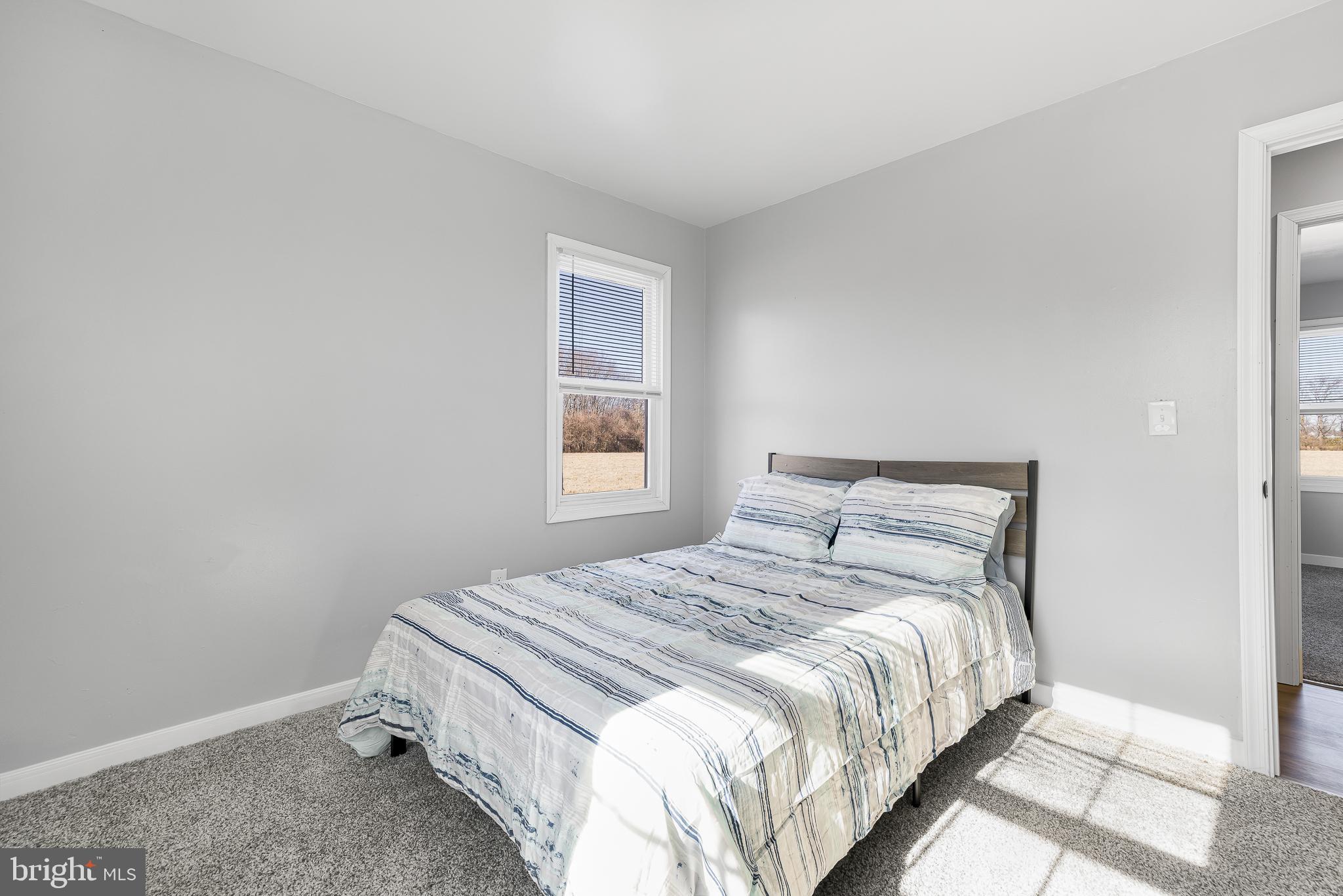 22041 Neal Road Lincoln, DE 19960 - Photo 17 of 28 a bedroom with a bed and a window