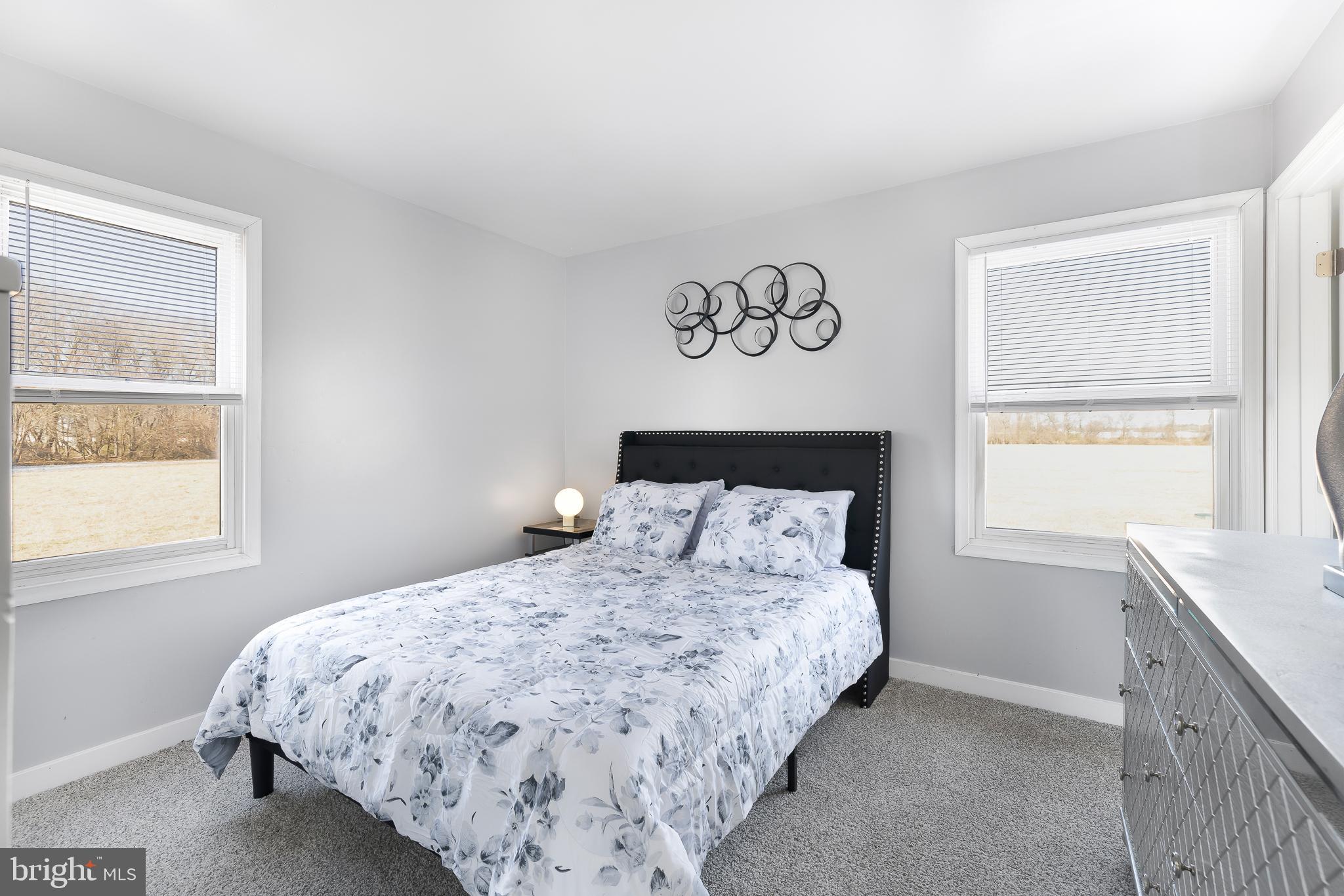 22041 Neal Road Lincoln, DE 19960 - Photo 19 of 28 a bedroom with a bed and a window