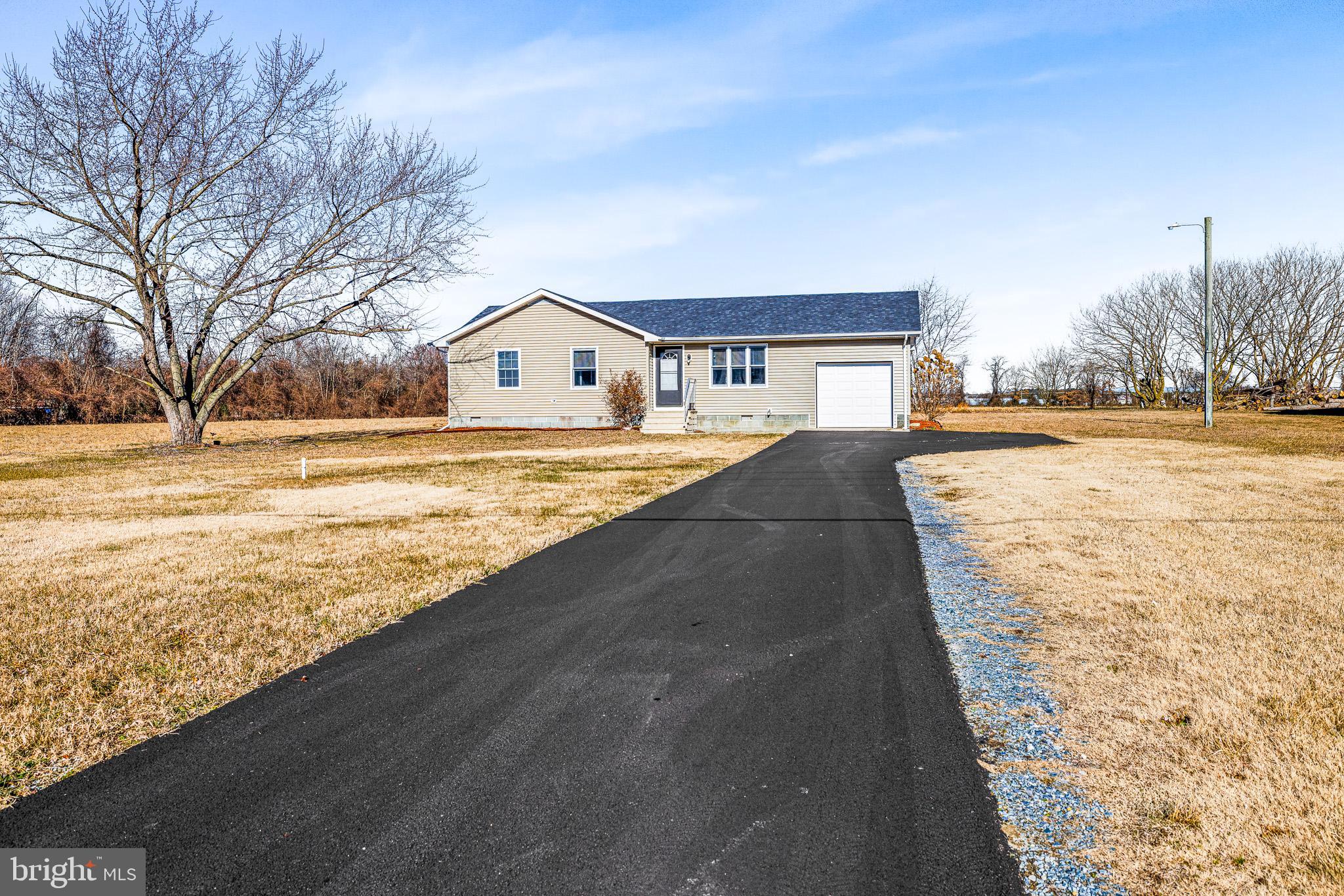 22041 Neal Road Lincoln, DE 19960 - Photo 2 of 28 a view of an ocean with palm trees
