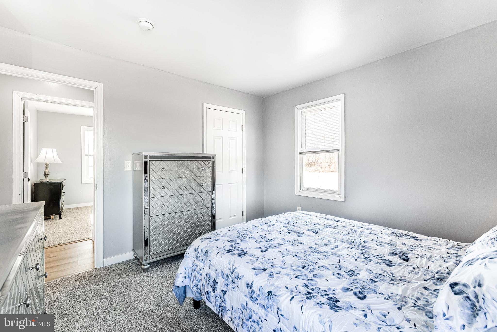 22041 Neal Road Lincoln, DE 19960 - Photo 21 of 28 a bedroom with a bed and a dresser