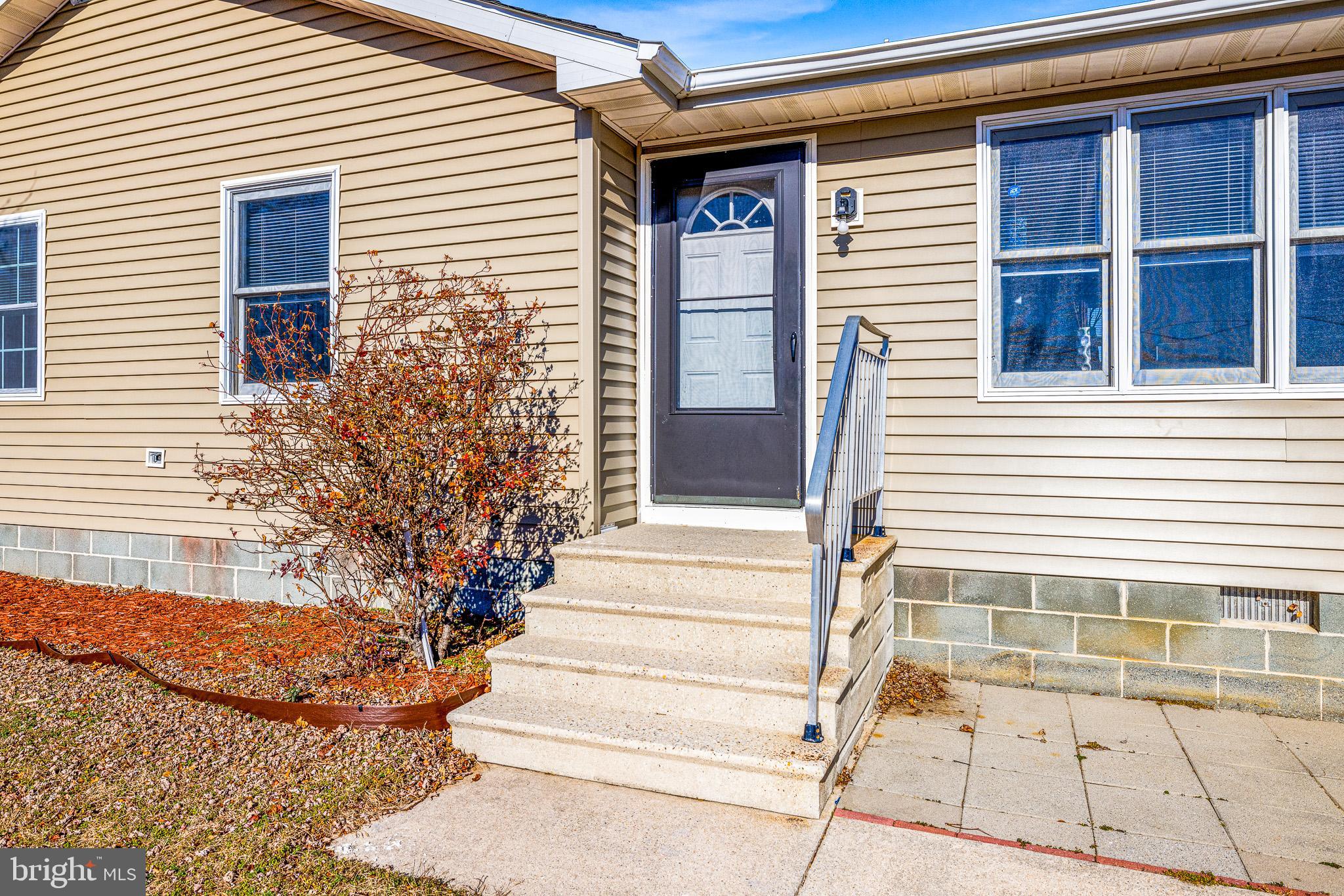 22041 Neal Road Lincoln, DE 19960 - Photo 3 of 28 a view of entrance of the house
