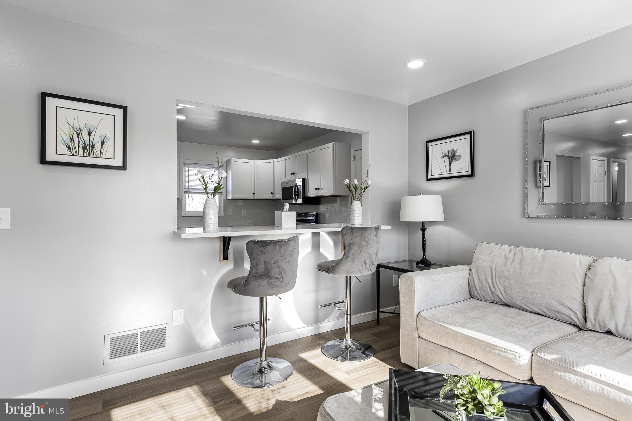 22041 Neal Road Lincoln, DE 19960 - Photo 6 of 28 a living room with furniture a rug and a table