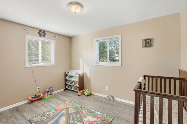 a bedroom with furniture and a window