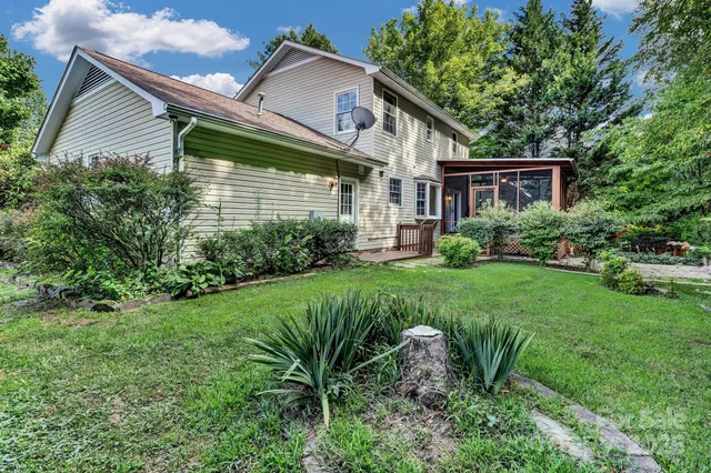 a view of a house with a yard and plants