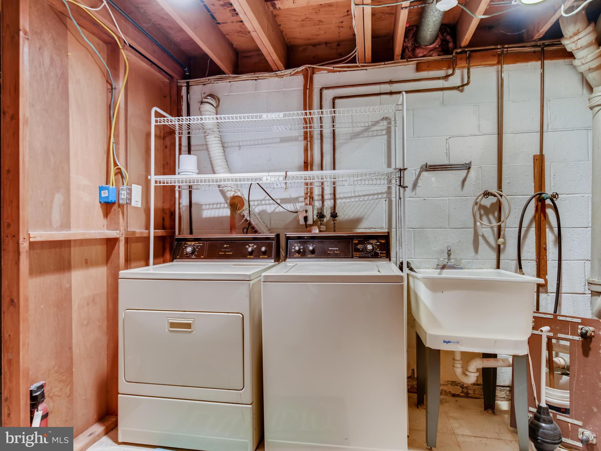 8614 Goldenwood Road Baltimore, MD 21237 - Photo 29 of 34 The laundry area has abundant storage & a freezer