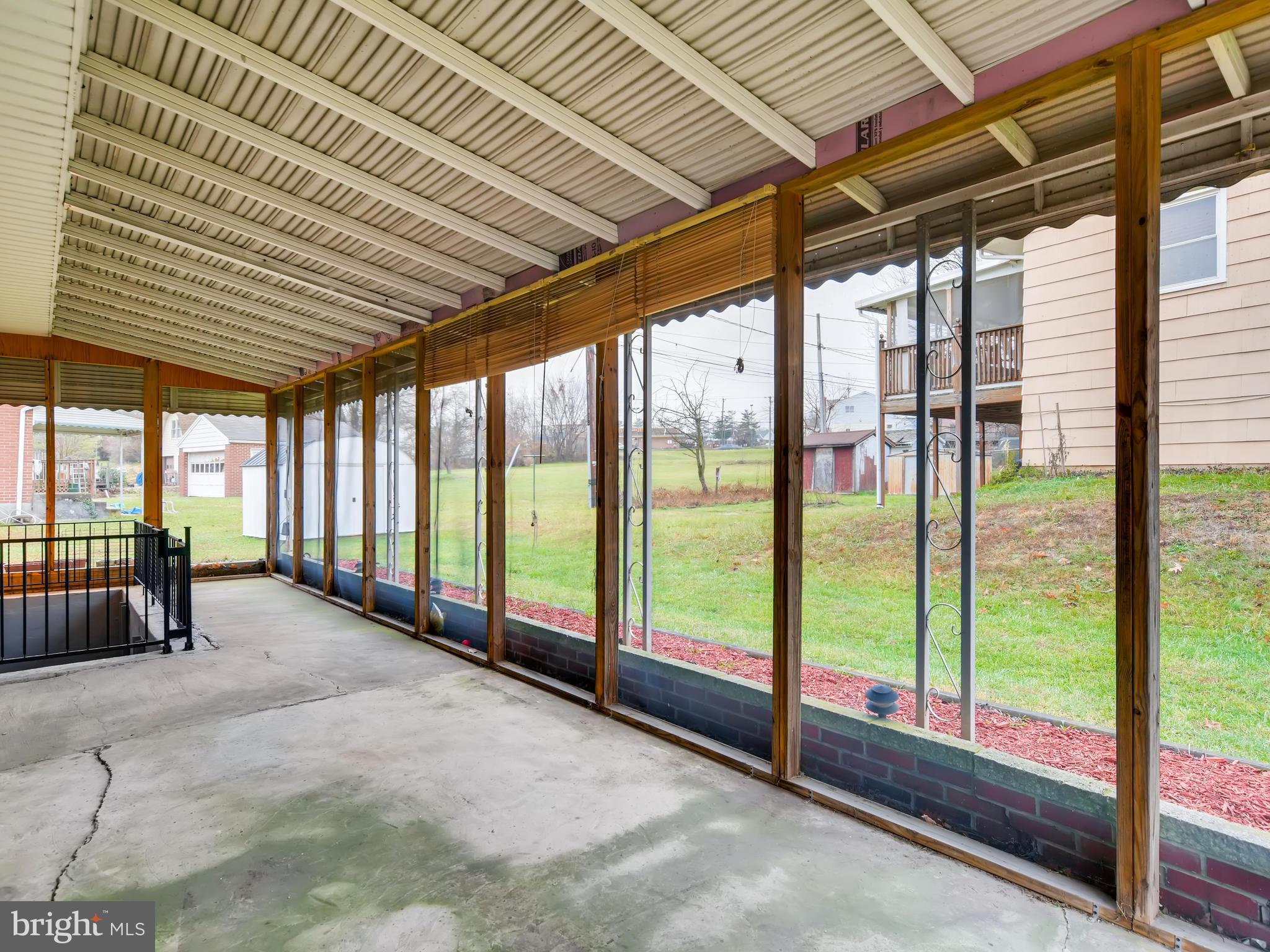 8614 Goldenwood Road Baltimore, MD 21237 - Photo 31 of 34 The screened-in patio is as long as the house