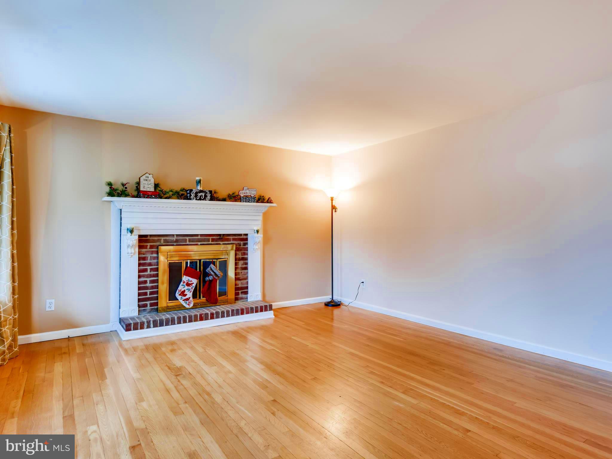 8614 Goldenwood Road Baltimore, MD 21237 - Photo 6 of 34 Snuggle up in front of the wood-burning fireplace