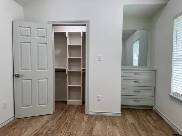 wooden floor and closet in a room