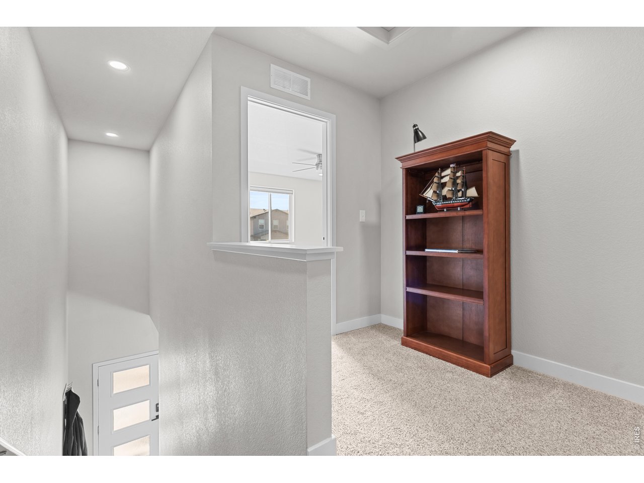6611 4th Street, Unit 1 Greeley, CO 80634 - Photo 26 of 48 Landing area between upper bedrooms, laundry, and shared bathroom.