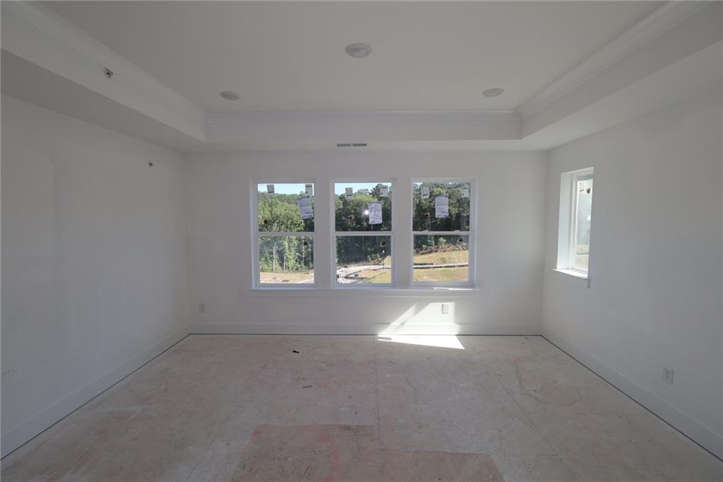222 Redbud Road Canton, GA 30114 - Photo 9 of 10 en empty room with a window