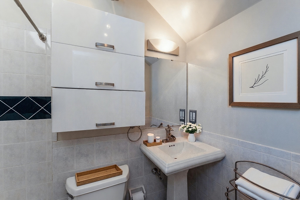 9 Fayette Street, Unit 4 Boston, MA 02116 - Photo 11 of 20 a bathroom with a sink and a mirror