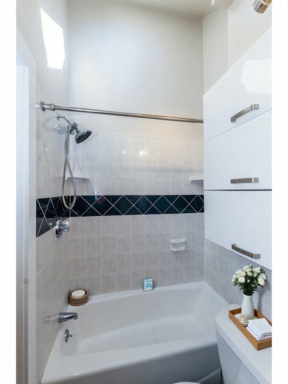 9 Fayette Street, Unit 4 Boston, MA 02116 - Photo 13 of 20 a bathroom with a bathtub and a shower