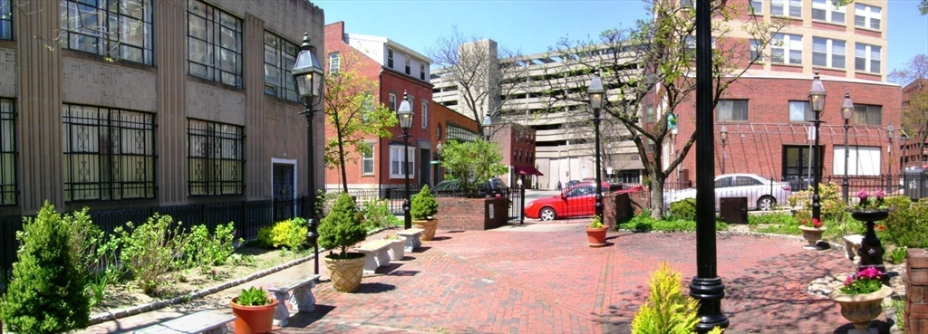 9 Fayette Street, Unit 4 Boston, MA 02116 - Photo 18 of 20 a front view of a multi story building with yard