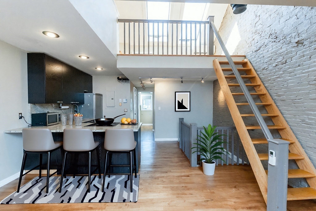9 Fayette Street, Unit 4 Boston, MA 02116 - Photo 4 of 20 a view of a dining room with furniture and wooden floor