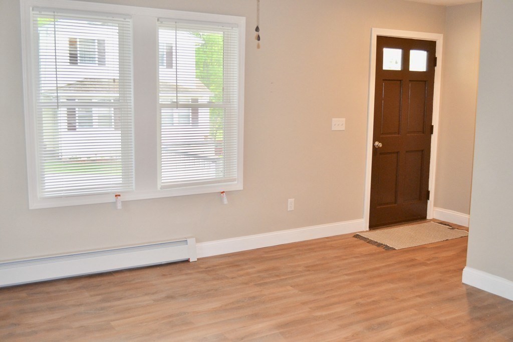 7 Havana Road Worcester, MA 01603 - Photo 5 of 10 a view of an empty room with wooden floor and a window