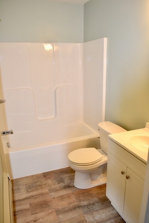 7 Havana Road Worcester, MA 01603 - Photo 6 of 10 a white toilet sitting next to a bath tub