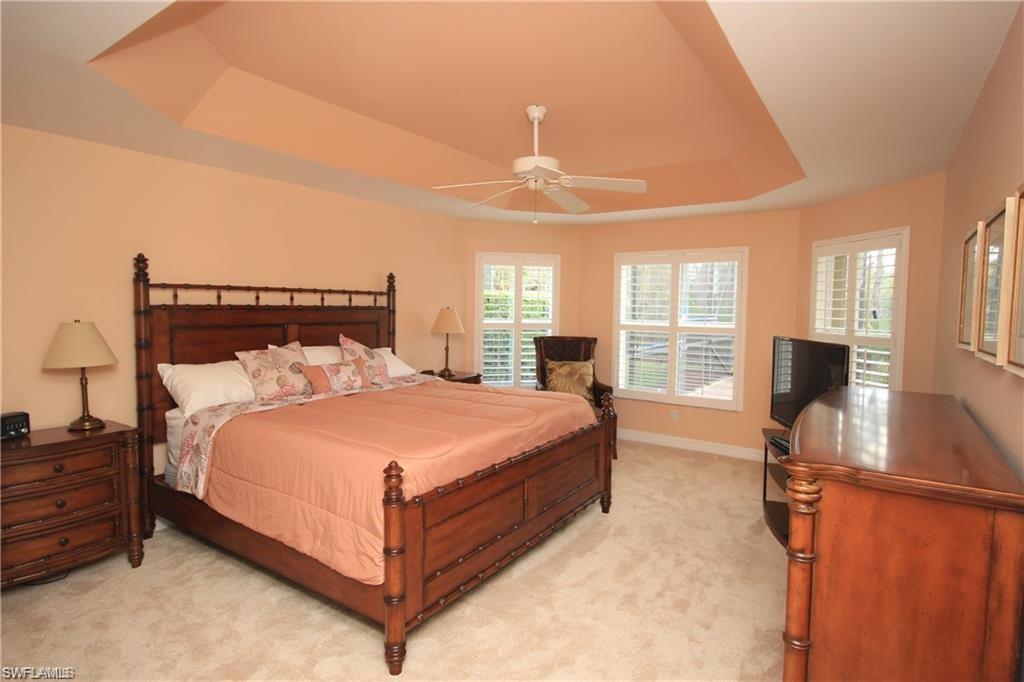 2322 Butterfly Palm Drive Naples, FL 34119 - Photo 11 of 32 a bed room with a bed and window